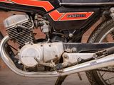 a close up of a motorcycle parked on the street