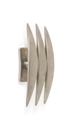 silver plated ring with curved design on a white background