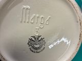a close up of a cup with a name on it