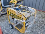 two portable generators sitting on top of a gravel ground next to a red fire hydrant