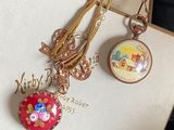 two necklaces that have been placed on a box