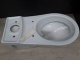 a close up of a white toilet with a wooden seat