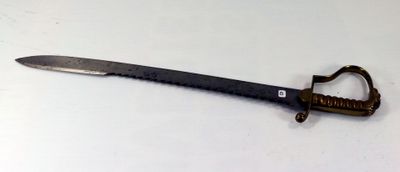 a knife that is laying on a table