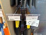 several pairs of scissors are on display in a store for sale