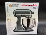 packaging of a kitchen aid mixer on a counter top