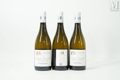 three bottles of wine sitting on top of a white table