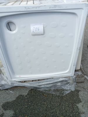 an image of a white refrigerator sitting on the ground