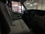 a view of the inside of a truck from the driver ' s seat