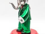 statue of an elephant in a suit with a pipe in its mouth