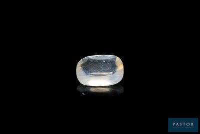 a white quartz stone on a black surface