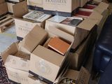 boxes of books stacked on top of each other in a living room