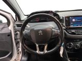 the interior of a car with a steering wheel and dashboard controls