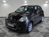 a picture of a small black car on a checkered floor