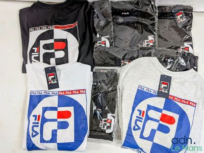 many t - shirts that are sitting on a table