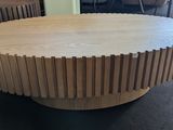 a wooden table with a circular design on top of it