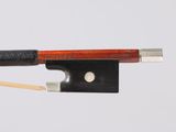 the bow is made of wood and has a black handle and a silver tip