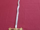 an image of a sword on a red table cloth