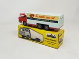 a toy truck that is sitting on top of a box