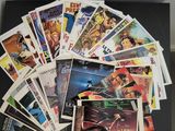 a bunch of comic books sitting on top of a black table