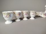 four cups sitting next to each other on a table