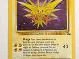 a close up of a pokemon card on a white surface
