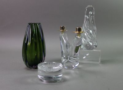 three glass vases sitting next to each other on a table