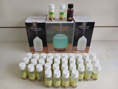 several bottles of essential oils sitting on a counter top next to a box of essential oils