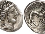 a silver coin with an image of a woman on it