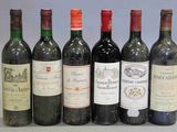 six bouteilles de vin sont alignées sur une table
