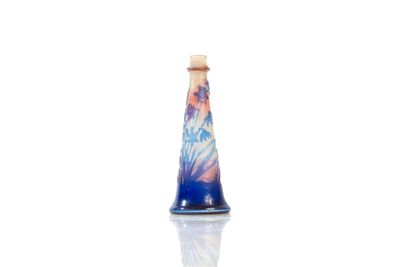 a small blue vase with a picture of a woman on it