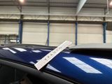 a sticker on the roof of a car that is parked in a garage