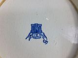 a blue and white plate with a castle on it