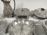 a lot of silver items that are on a table