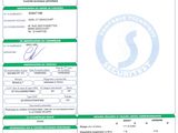 a green and white document with a picture of a person ' s identification