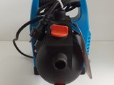 a blue and black air compressor on a white table