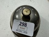 a small metal object on a table with a price tag on it