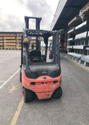 a forklift truck that is parked in a parking lot