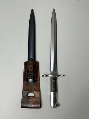 an image of a knife and sheath on a white surface