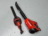 two tools that are laying on the floor next to each other