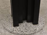 a black table with a marble top and a black base