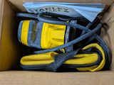 a box that has a yellow and black hose and a yellow and black hose in it