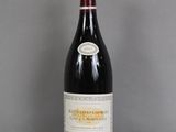 a bottle of wine that is sitting on a table