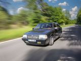 a car that is driving down the road in the daytime