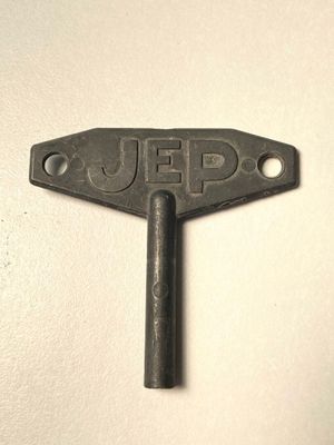 a metal key with the word jeep on it