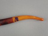 a pipe that has a purple and yellow design on it