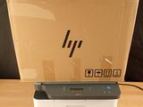 a printer sitting on top of a box on a table