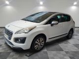 the small white car is parked in the room on a checkered floor