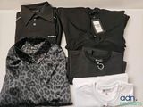 trois chemises pour homme et une chemise pour femme posées sur une table