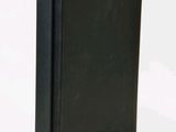 an image of a black book sitting on top of a white table