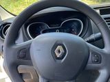 the interior of a car with a steering wheel and dashboard controls